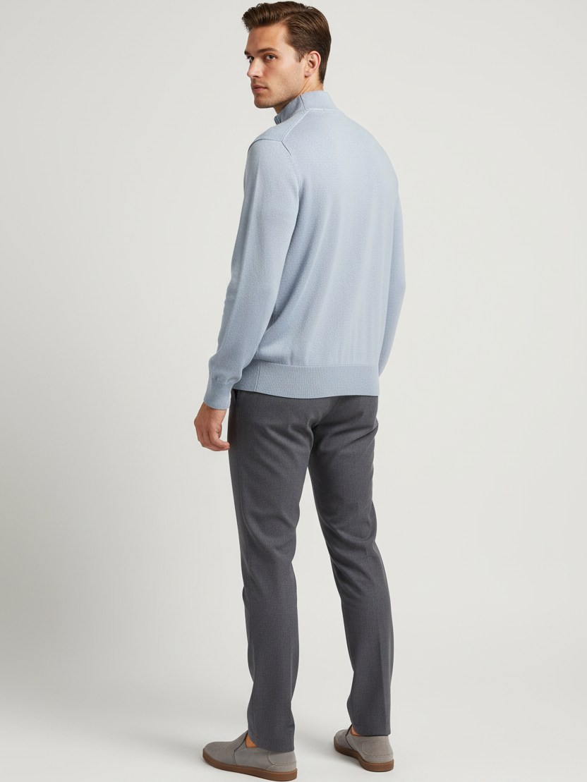 Back view of a male model wearing the Lux light-blue sweater with Wam Denim neck branding