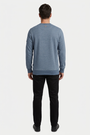 Daelor Blue sweater on model, back view
