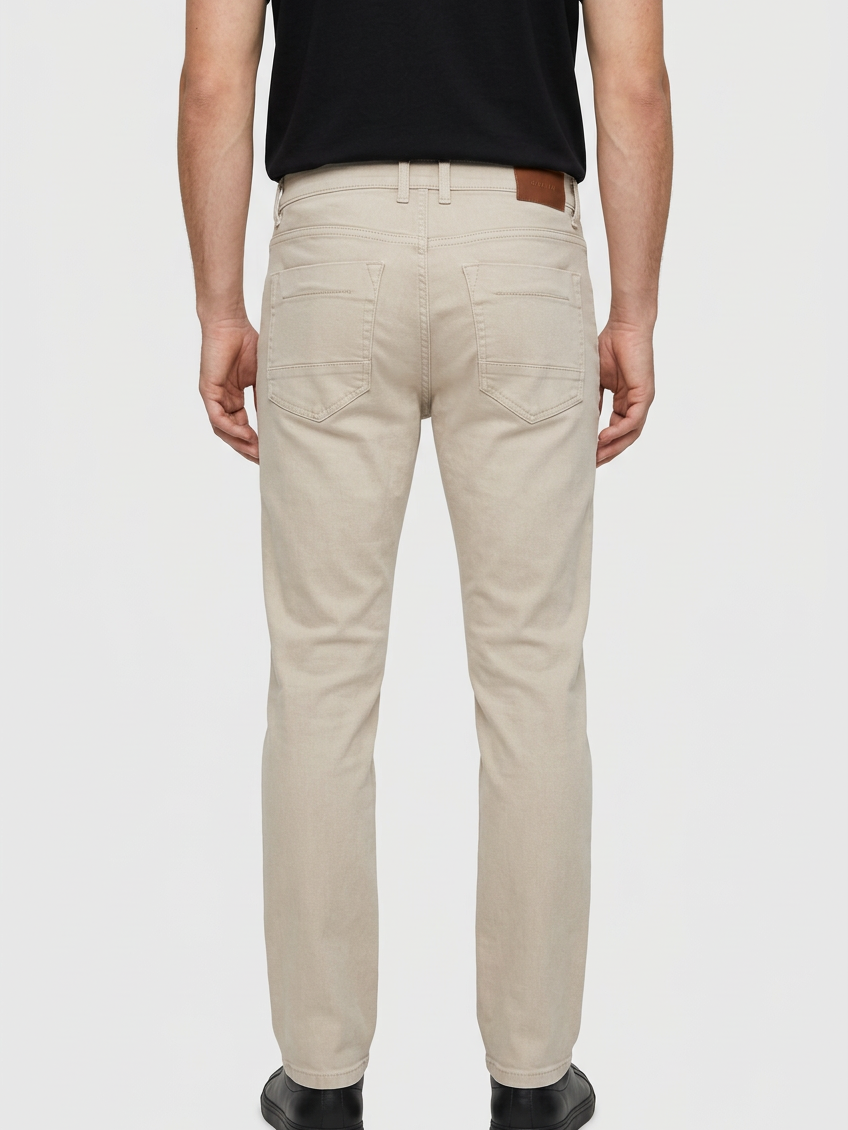 Grelix Light Beige jeans on model, back view