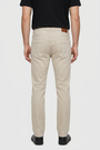 Grelix Light Beige jeans on model, back view