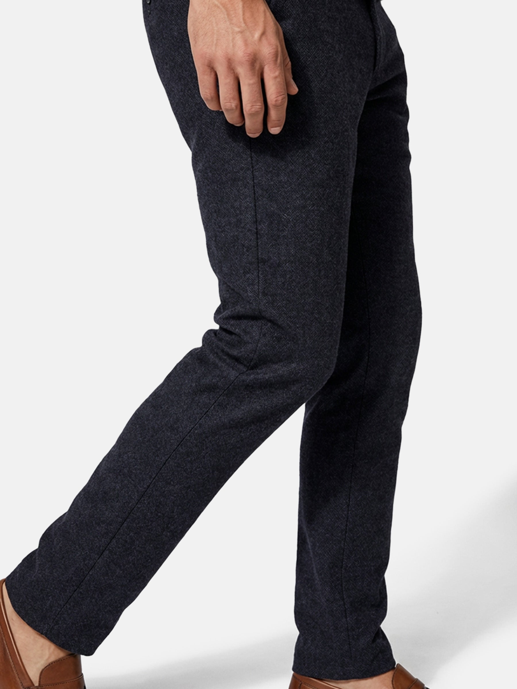 Side view of dark navy men’s chino trousers highlighting slim fit and textured fabric.
