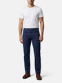 Men wearing navy slim-fit jeans styled with white T-shirt and brown leather shoes