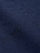 Close-up of navy denim fabric showing smooth weave and premium texture